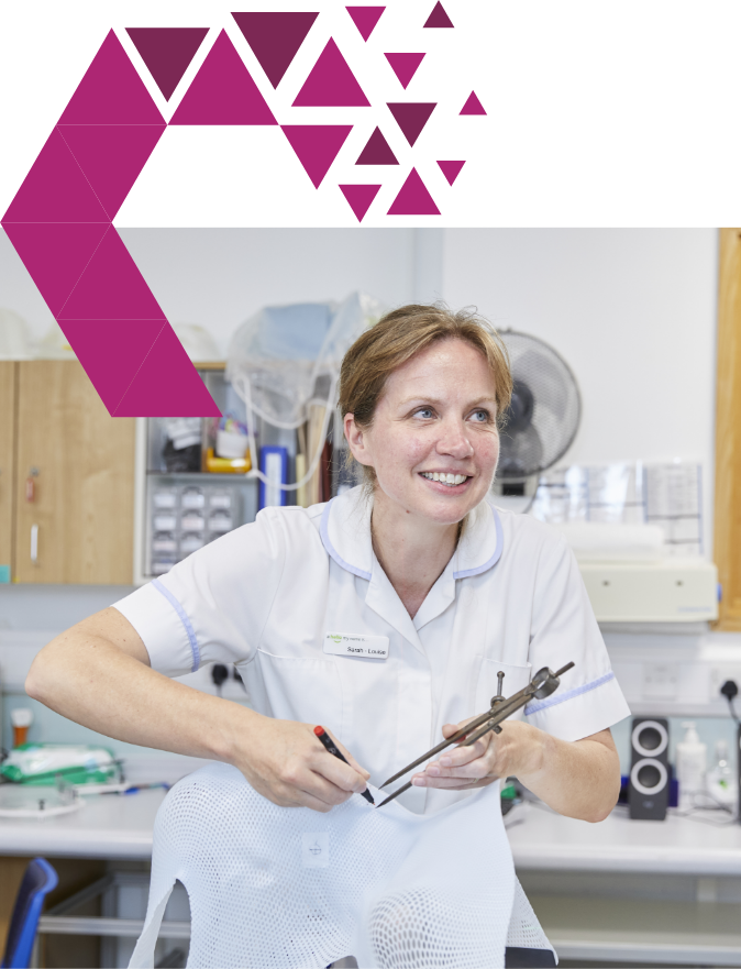 A cheerful nurse in a white uniform sits on a stool in a clinic, holding some medical instruments, with a fan in the background. she is listening intently, mid-conversation.